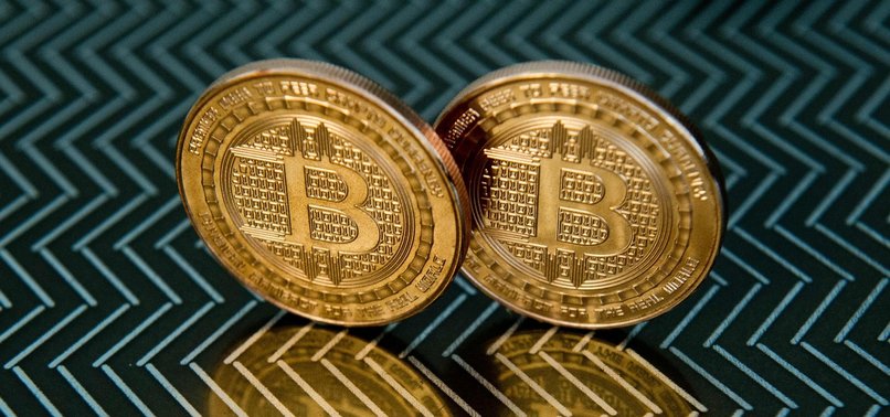 BITCOIN HITS NEW RECORD AFTER PLANS TO OFFER FUTURES