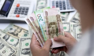 Russian rouble falls back towards 75 vs dollar as tax period hits peak