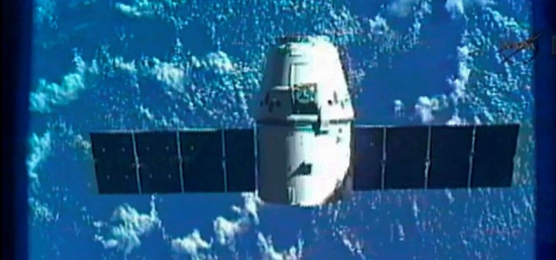 SPACEX DRAGON CARGO CARRIER DOCKS WITH ISS OVER PACIFIC