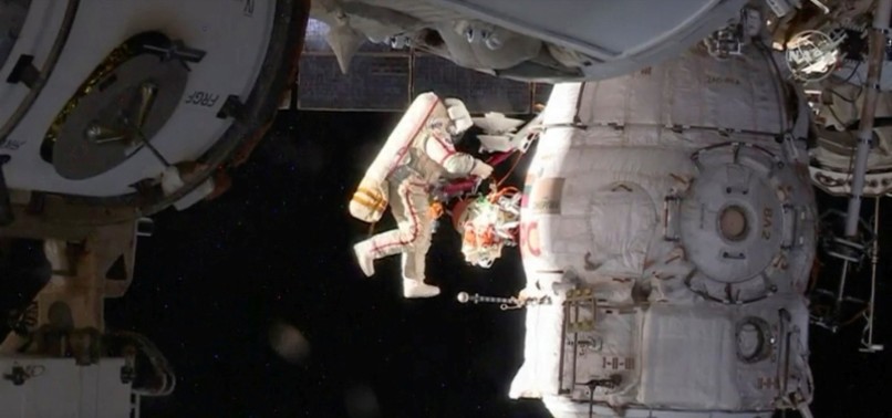 ISS ASTRONAUTS ON 8-HOUR SPACEWALK, INVESTIGATING HOLE IN SOYUZ CRAFT