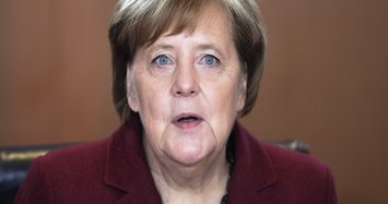 Merkel wants coalition to hold despite shock exit of SPD leader