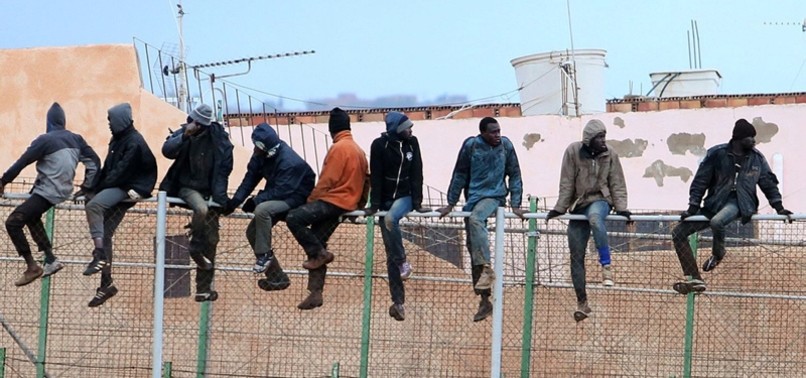 HUNDREDS OF MIGRANTS STORM BORDER OF SPANISH ENCLAVE IN NORTH AFRICA