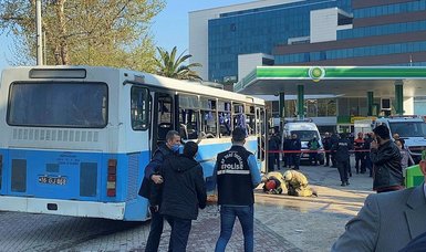 Explosion on bus carrying prison guards leaves one dead