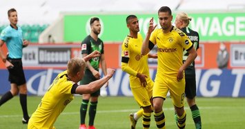Dortmund ease past Wolfsburg 2-0 to stay in title hunt