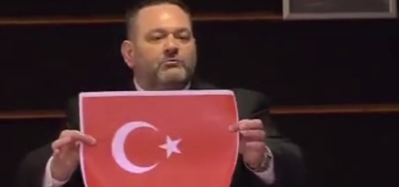 TURKS IN EUROPE SUE GREEK MEP WHO RIPPED TURKISH FLAG