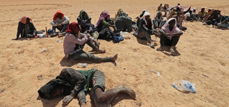 LIBYAN BORDER GUARDS RESCUE MIGRANTS IN DESERT NEAR TUNISIA