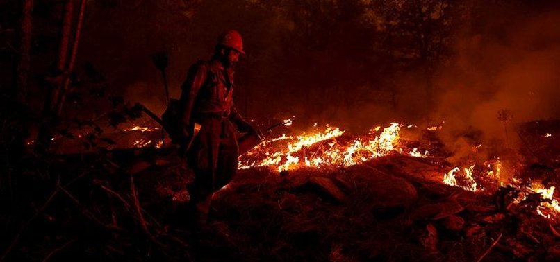 HUGE CALIFORNIA WILDFIRE GROWS, BUT WEATHER HELPS FIREFIGHTERS