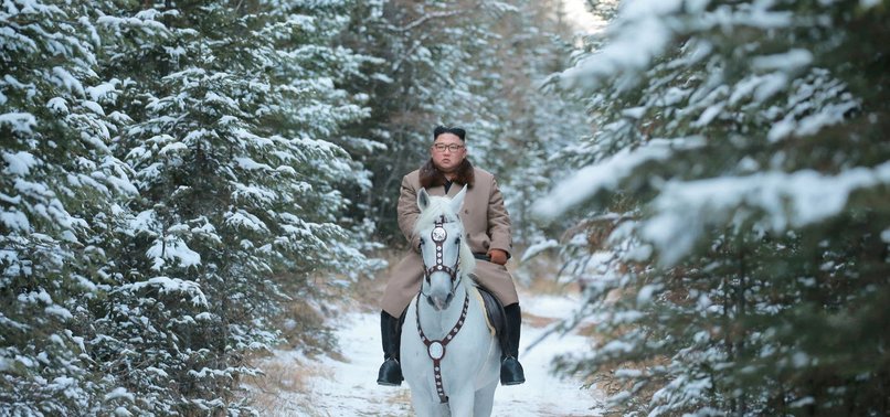 KIM RIDES WHITE HORSE UP NORTH KOREAS SACRED PEAK