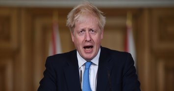 UK's Johnson threatens to impose restrictions on Manchester