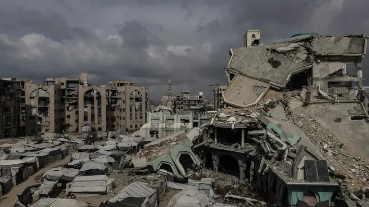 Displaced Gaza families struggle in tents near damaged Islamic University
