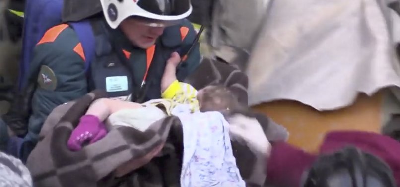 RESCUERS PULL BABY ALIVE FROM RUSSIAN BLOCK AFTER GAS BLAST