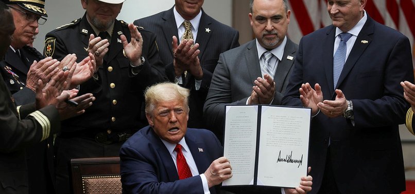 DONALD TRUMP SIGNS EXECUTIVE ORDER ON POLICE REFORM IN RESPONSE TO NATIONWIDE ANGER AT RACISM