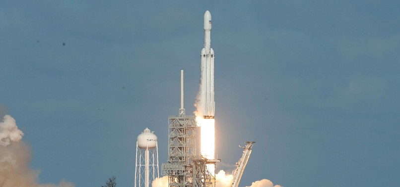 SPACEXS FALCON HEAVY ROCKET BLASTS OFF FROM KENNEDY SPACE CENTER TOWARD MARS