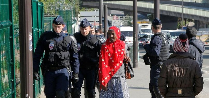 PARIS POLICE CLEAR HUNDREDS FROM MAKESHIFT REFUGEE CAMP