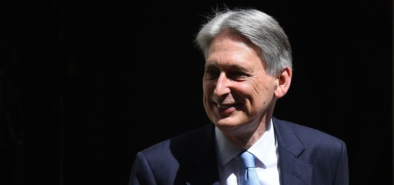 UKS HAMMOND QUITS AS FINANCE MINISTER BEFORE JOHNSON BECOMES PM