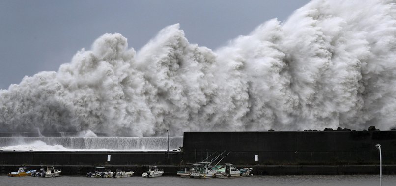 STRONG TYPHOON HITS WEST JAPAN; 2 DEAD, AIRPORT FLOODED