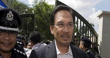Malaysia's Anwar says wanted 1MDB suspect to get fair trial