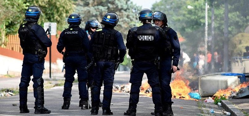 TWELVE ARRESTED IN RIOTS OVER POLICE KILLING OF FRENCH YOUTH