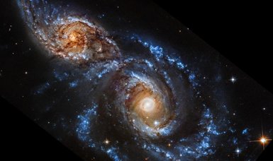 NASA reveals stunning image of interacting galaxies NGC 2207 and IC 2163