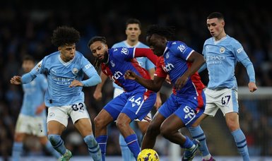 Olise's late penalty rocks Man City as Palace hold champions