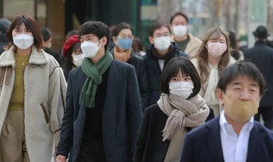 Japan's new COVID-19 infections top 60,000 for first time