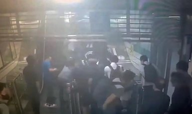 Escalator packed with riders suddenly reverses, injuring 14 at busy South Korean subway station,