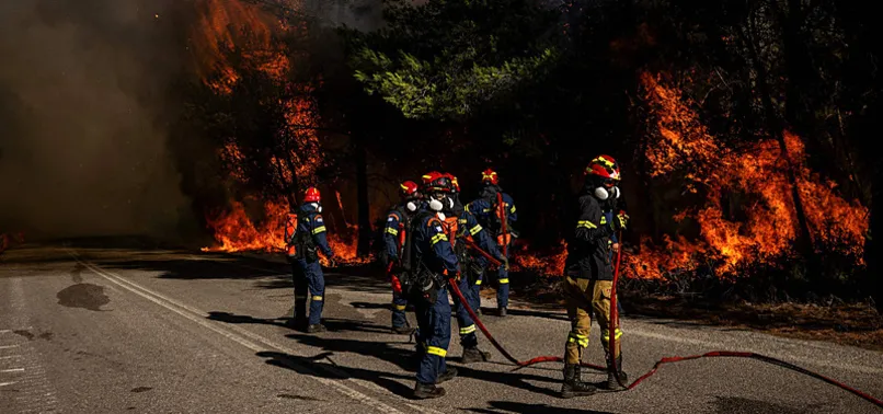 WILDFIRE WEST OF ATHENS TRIGGERS NEW EVACUATIONS; 2 ARRESTED