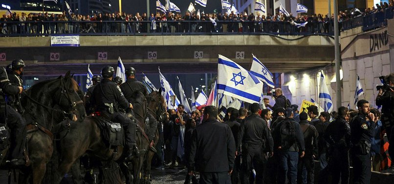 ISRAELI DEFENSE MINISTER CALLS FOR HALTING JUDICIAL OVERHAUL AMID PROTESTS
