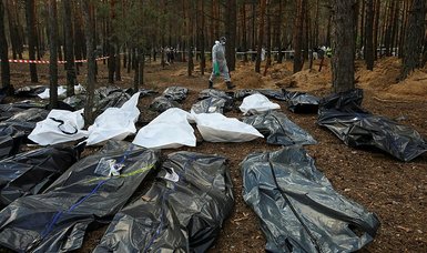 Ukraine probes suspected mass burial on Russia border