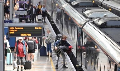 British train passengers face disruption as rail workers on strike