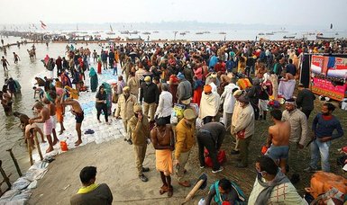 Hundreds of thousands of Hindu pilgrims bathe in Ganges River despite surge in COVID cases
