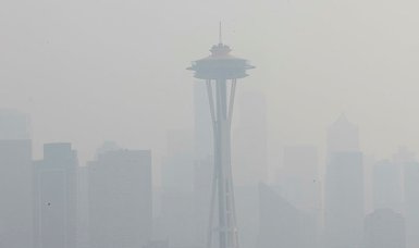 Wildfire smoke chokes U.S. Northwest, residents don masks