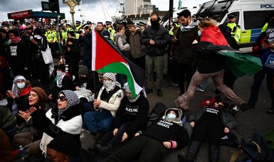 Pro-Palestinian protesters stage sit-in at London Westminster Bridge