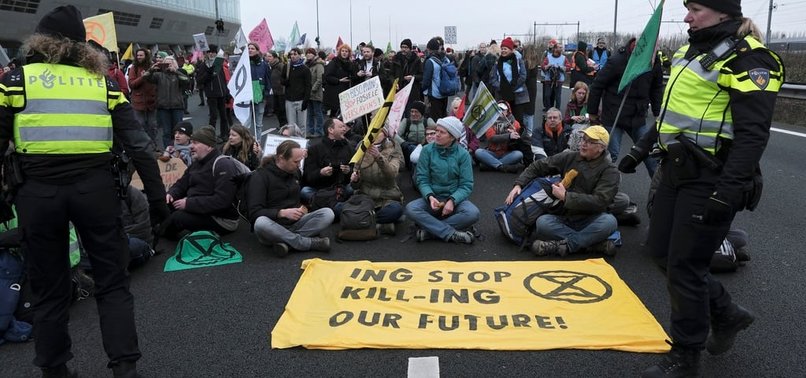 CLIMATE ACTIVISTS BLOCK AMSTERDAM HIGHWAY IN PROTEST AGAINST ING