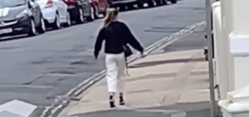 VIDEO OF U.S. WOMAN THAT APPEARED TO BE FROZEN IN TIME WHILE WALKING DOWN STREET GOES VIRAL