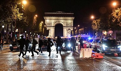 French police evacuate Paris' Champs-Elysees, including tourists, amid ongoing protests