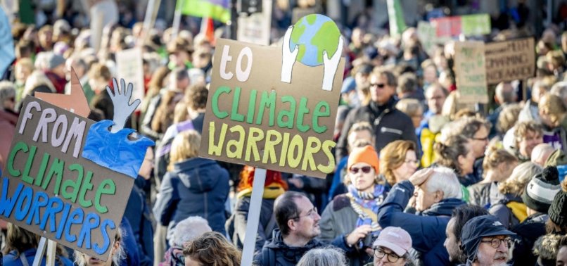 AMSTERDAM MARCHERS DEMAND CLIMATE ACTION AS DUTCH ELECTION NEARS