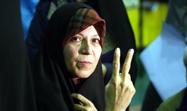 Iran ex-president's daughter held, charged amid protests