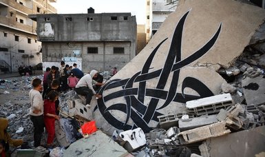 Palestinian graffiti artist Bilal Khalid shows pain of Gazans on walls of destroyed buildings