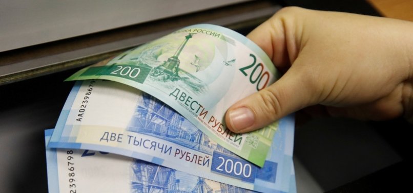 RUSSIAN ROUBLE EASES TOWARDS MID-JANUARY LOWS VS DOLLAR