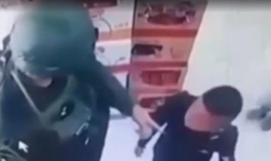 Israeli soldiers assault Palestinian child over T-shirt emblazoned with gun
