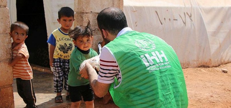 TURKISH AID AGENCY PROVIDES CLOTHES TO SYRIAN ORPHANS