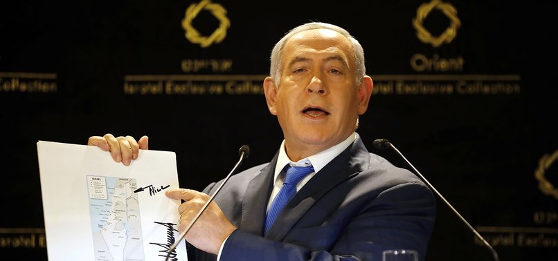 NETANYAHU SHOWS OFF TRUMPS MAP OF ISRAEL WITH GOLAN HEIGHTS MARKED NICE